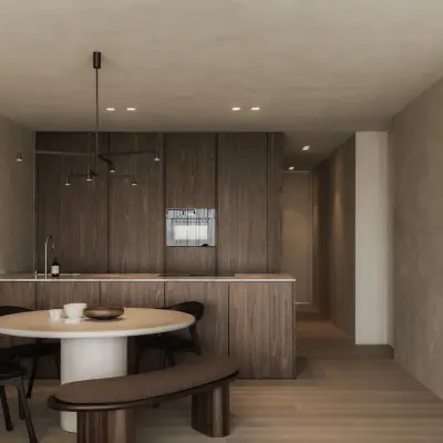 Open keuken en eethoek met doorkijk naar de gang en een kunstwerk aan de gepleisterde wand, Appartement in Nieuwpoort, interieur Laura Calleeuw