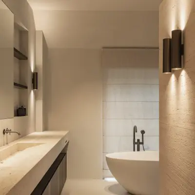 Badkamer met travertijnen wastafel, wandlamp en vrijstaand bad, Gezinsvilla in Heusden-Zolder, interieur Laura Calleeuw