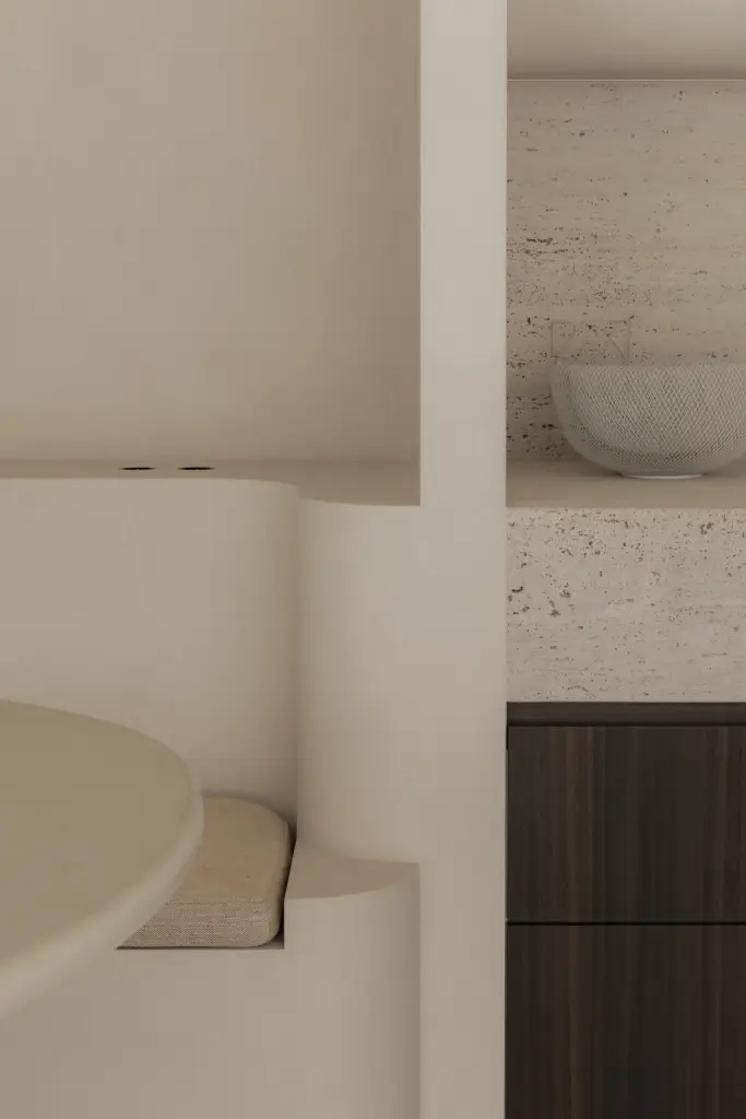 Detail van afgeronde zitbank, tafel en travertijn in de eethoek, Nieuwbouwwoning in Roeselare, interieur Laura Calleeuw